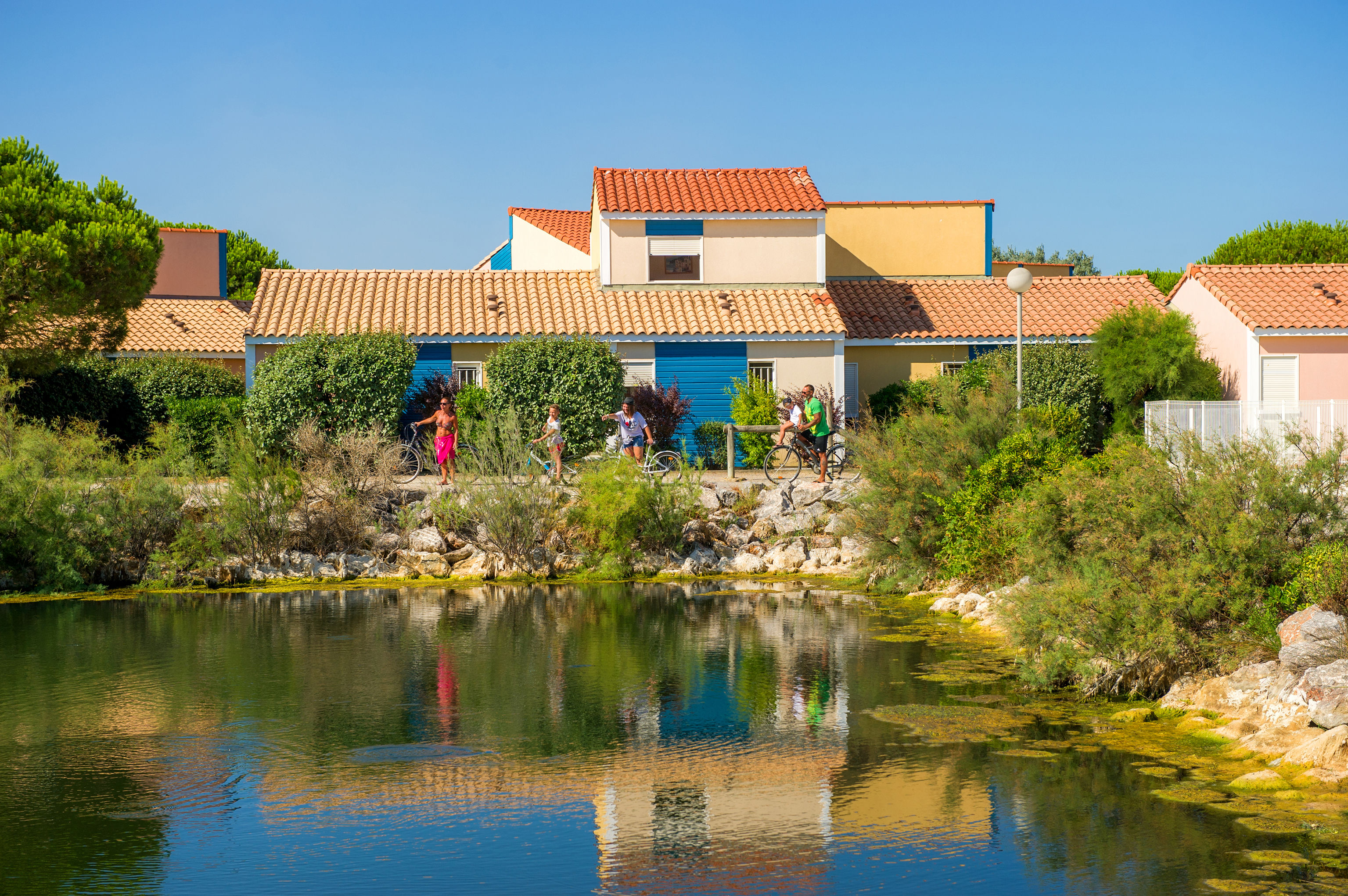 image The ornamental pond at the heart of Le Village Club Marin, surrounded by the resort's colourful Mediterranean-style cottages.