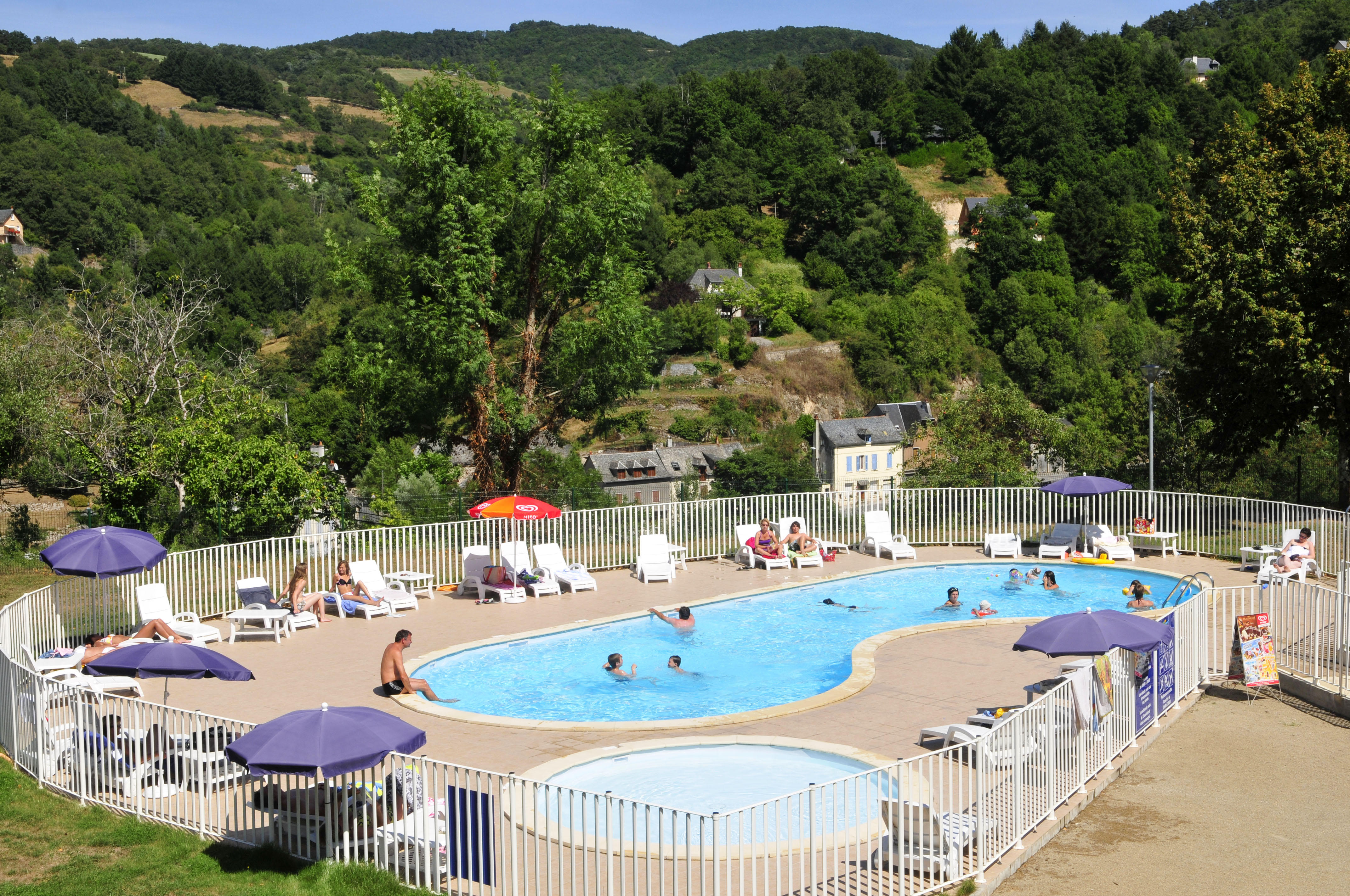 image The outdoor heated pool and sun terrace, open from mid-May to mid-September with the Aveyron hillsides as a backdrop.