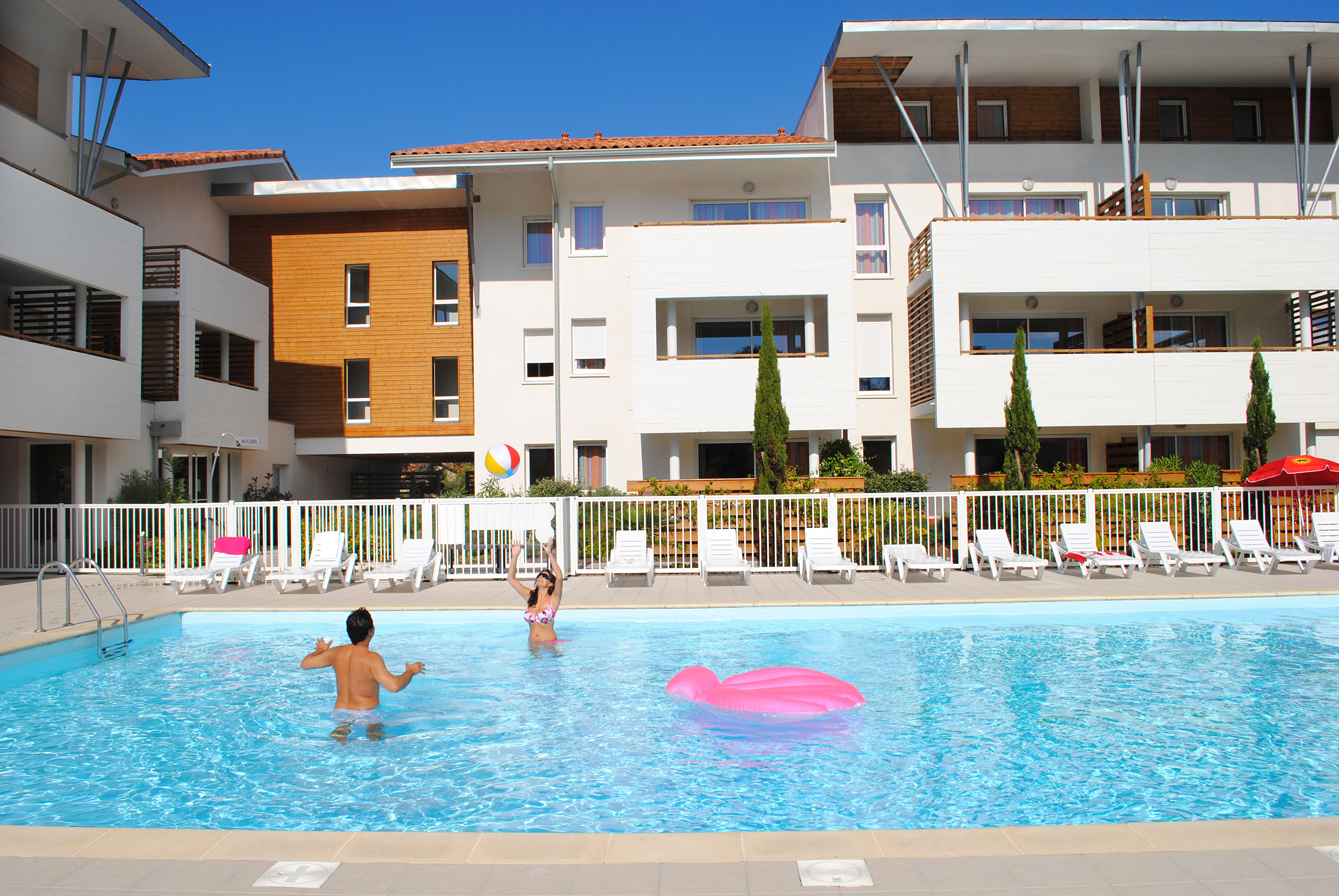 image The residence wraps around the pool, keeping it conveniently close from every apartment.