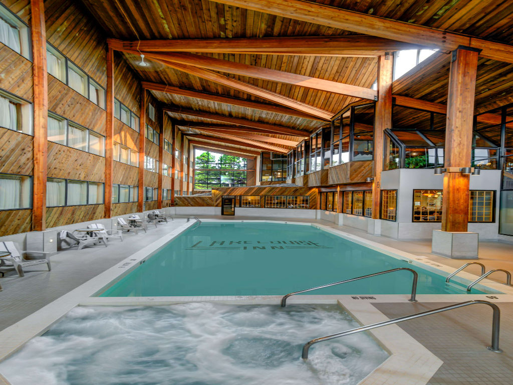 image Relax and unwind in a serene indoor retreat, surrounded by warm wooden accents and calming waters.