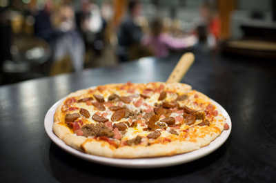 Savor the comforting flavors of freshly made pizza, perfect for a cozy evening.