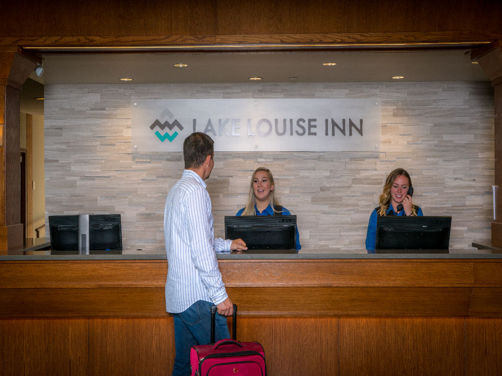 image Friendly faces greet you at check-in, ready to make your stay unforgettable.