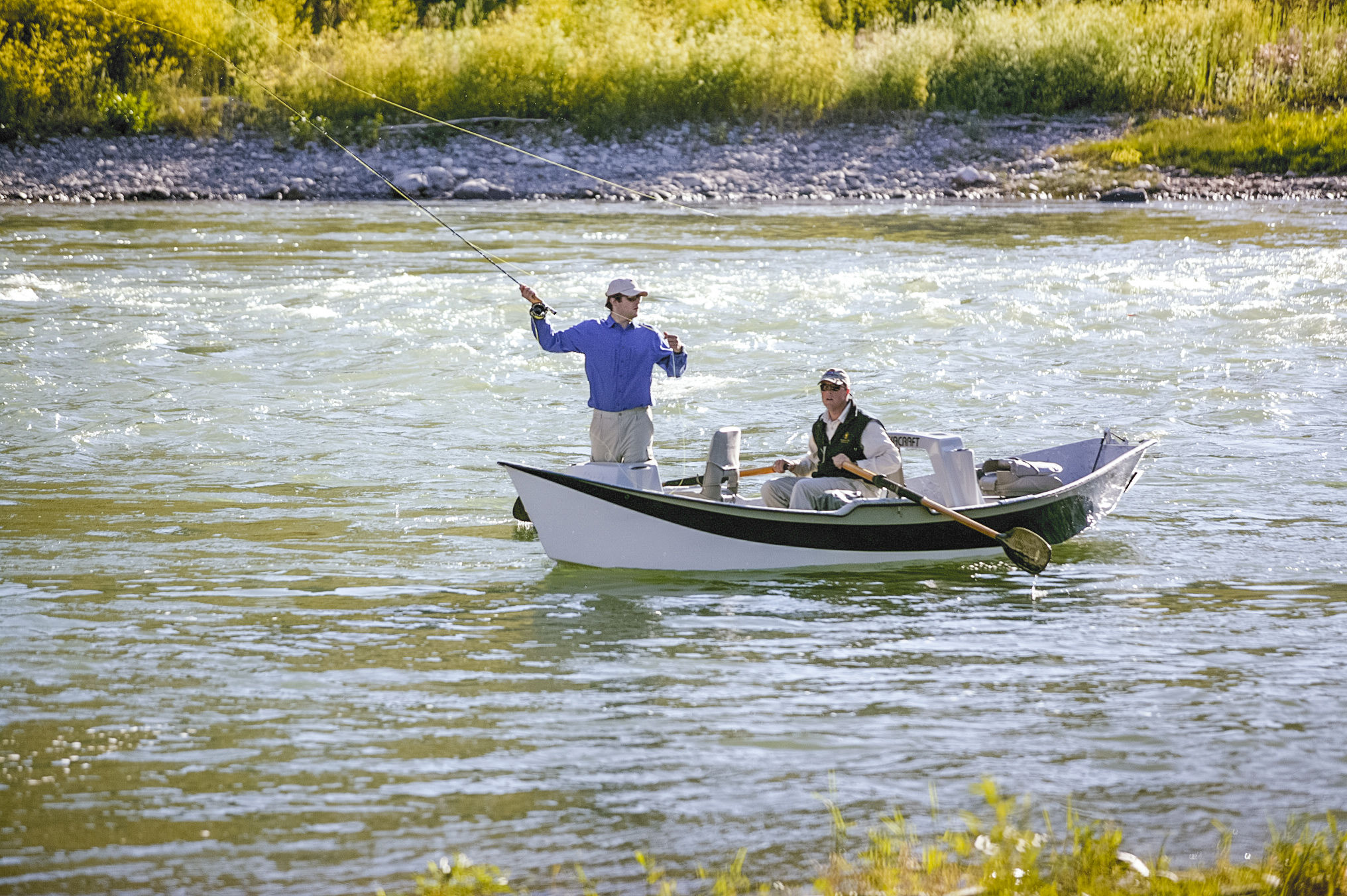 image Wading into blue-ribbon fly fishing water on the Snake River, guided trips bookable through the sports shop