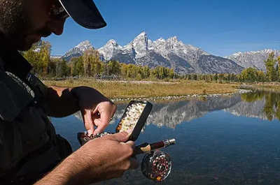 Fly rods and tackle come out with the Teton Mountains in view.