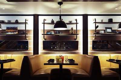 Booth seating at Spur Restaurant & Bar overlooks the dining room.