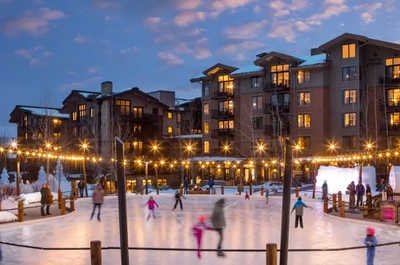 Skaters glide across the outdoor rink on the Commons in Teton Village.
