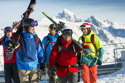 Skiers line up for the chairlift on a powder morning.