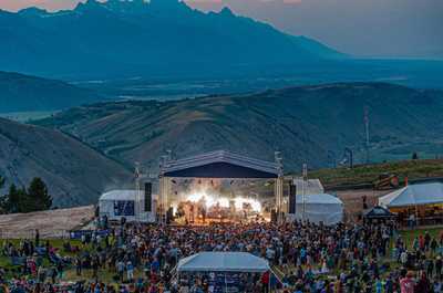 Live music fills the mountain air during an outdoor concert at Snow King.