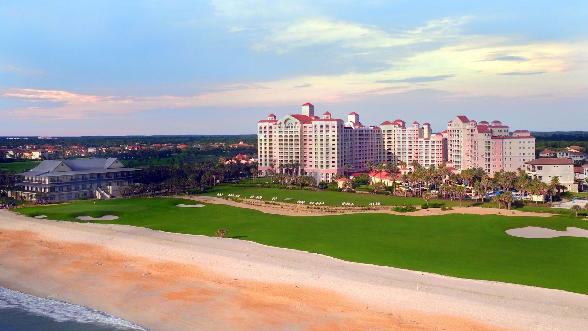 image Resort complex and golf course stretching alongside the Atlantic at golden hour