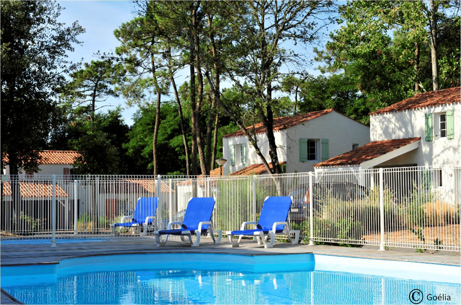 image The fenced pool area keeps little ones safe while you relax on one of the poolside loungers.