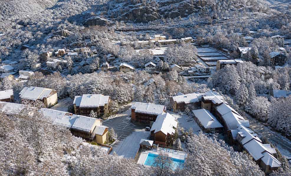 image Snow settles over the residence in winter, with dog sledding and snowshoeing nearby.