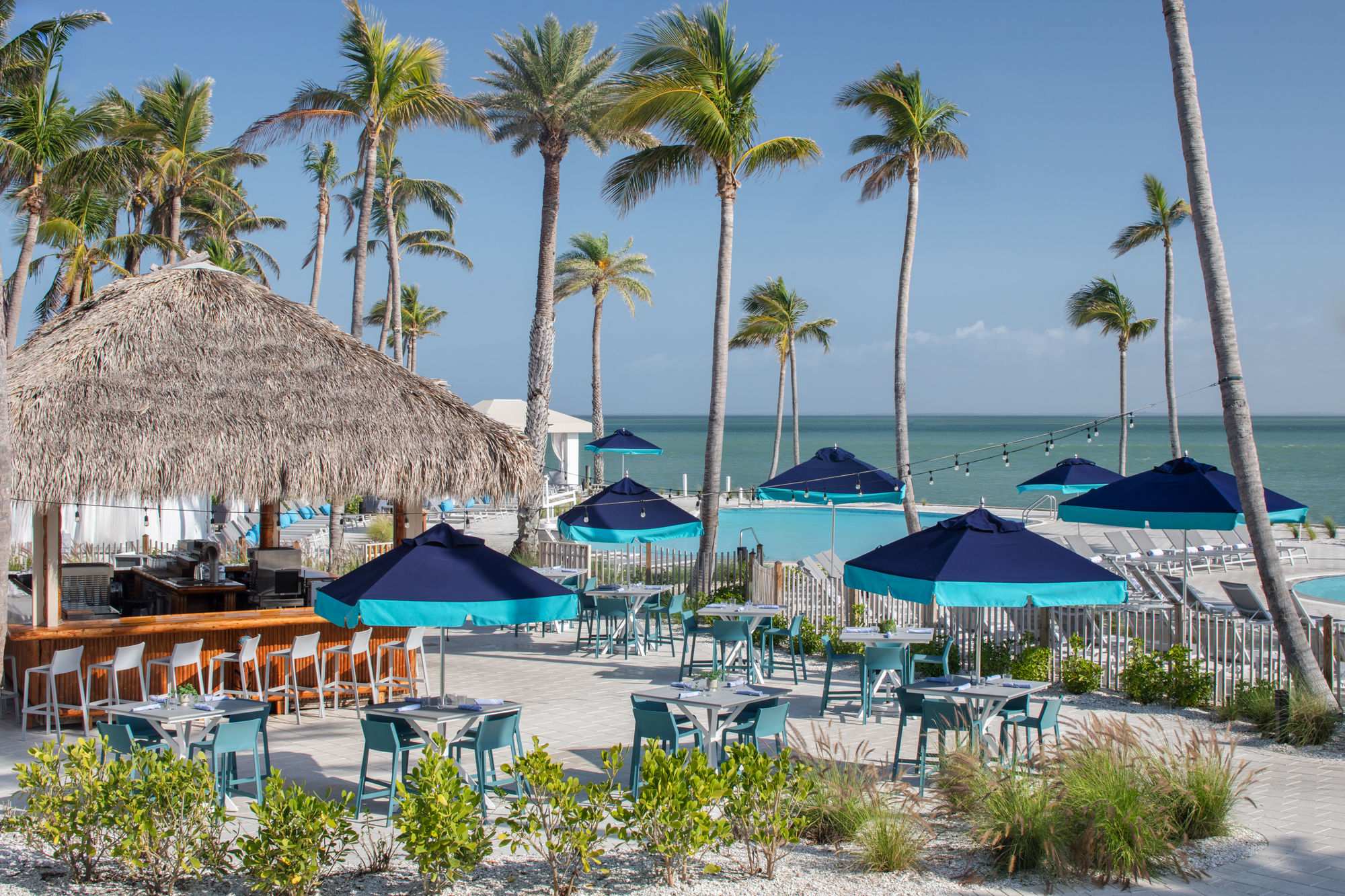 image Luxuriate in island serenity at this iconic poolside bar, sipping frozen fusion drinks like a Piña Colada or Frozé.