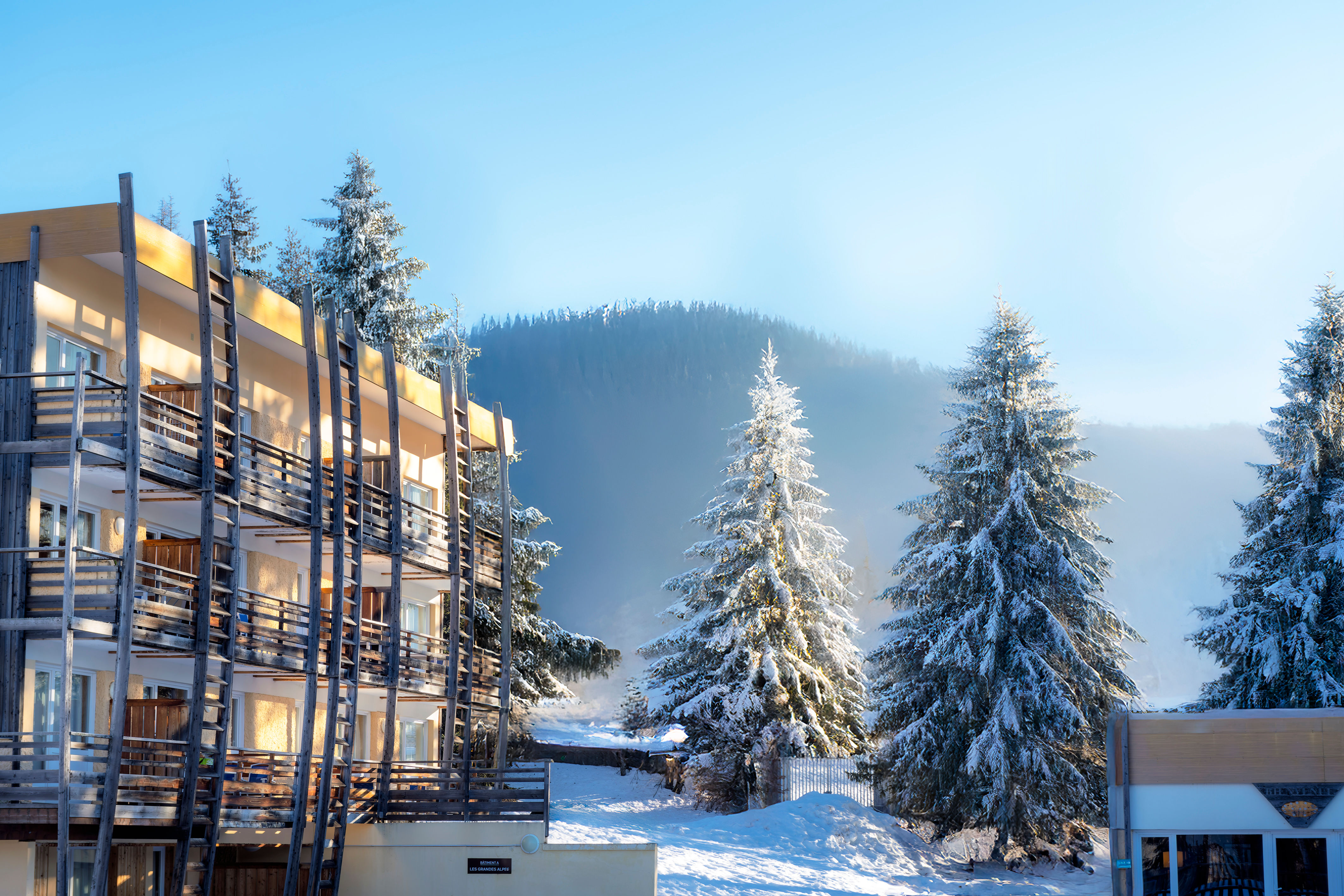image Step out onto your balcony and take in the frosted pines below.