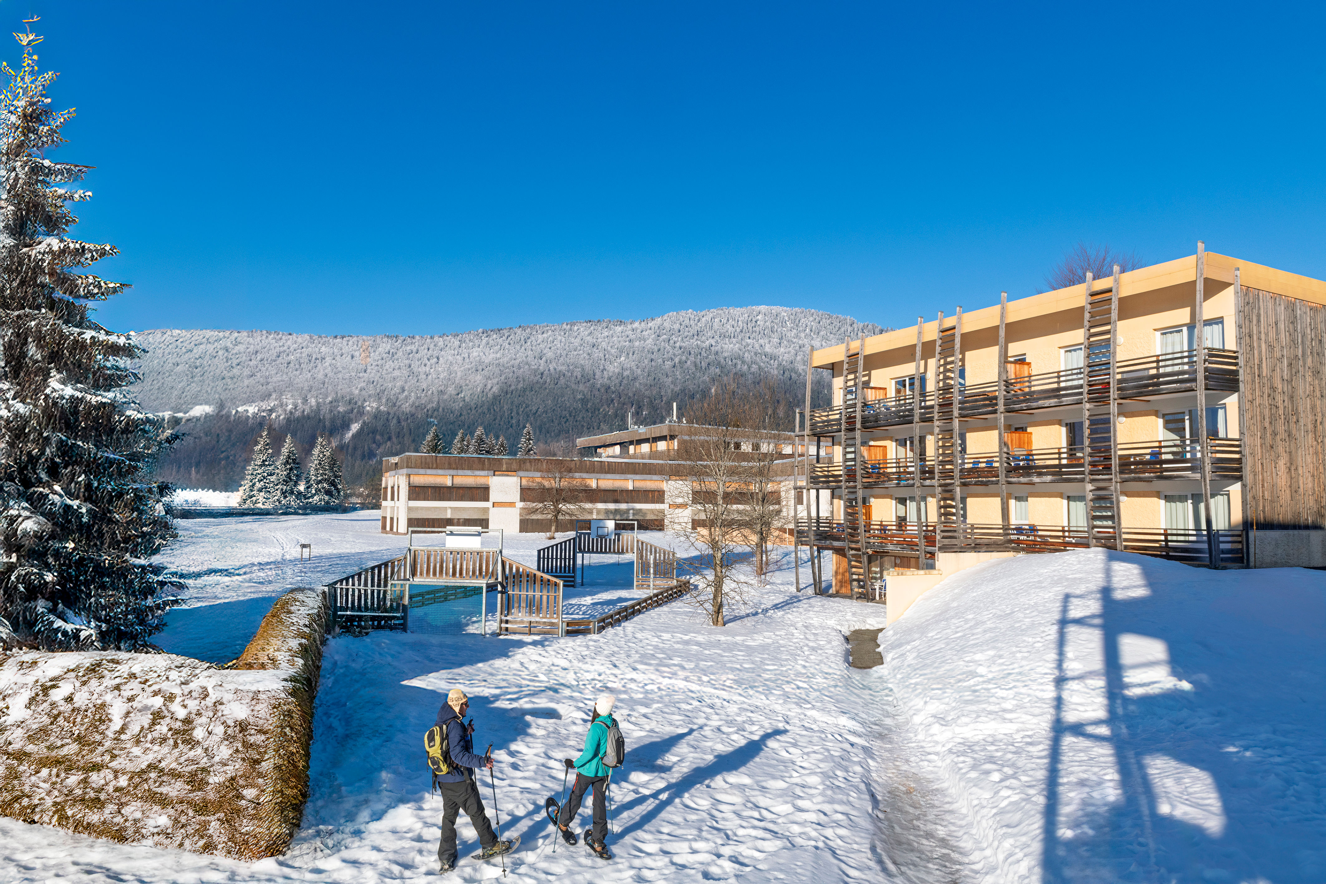 image Arrive to snow-covered grounds with the mountains as your backdrop.