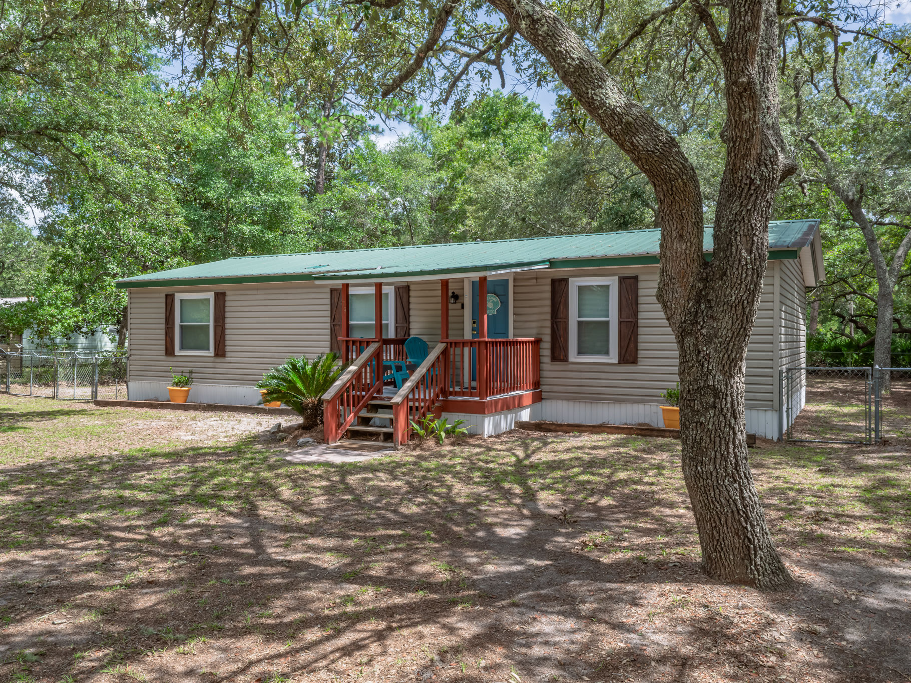 image Open side yard offers room for lawn games or a quiet evening outside.