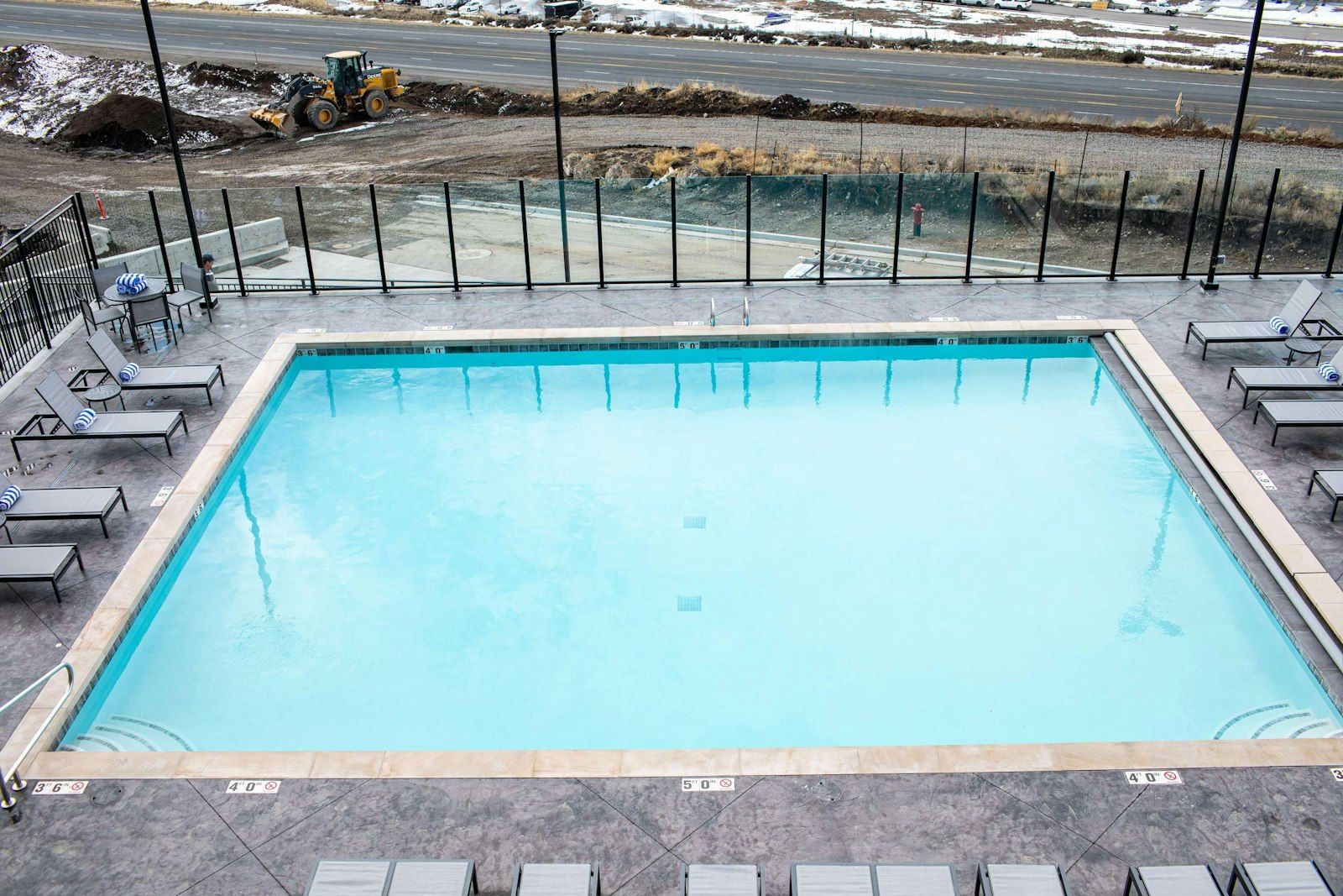 image Outdoor pool and hot tub with mountainside views