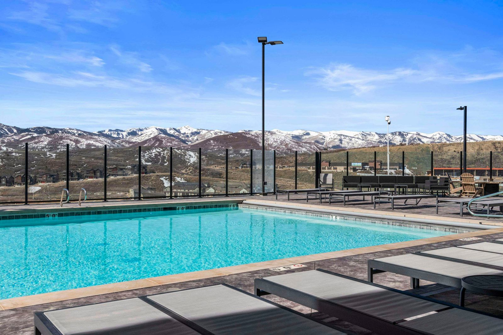 image Rooftop pool with panoramic mountain views and lounge chairs