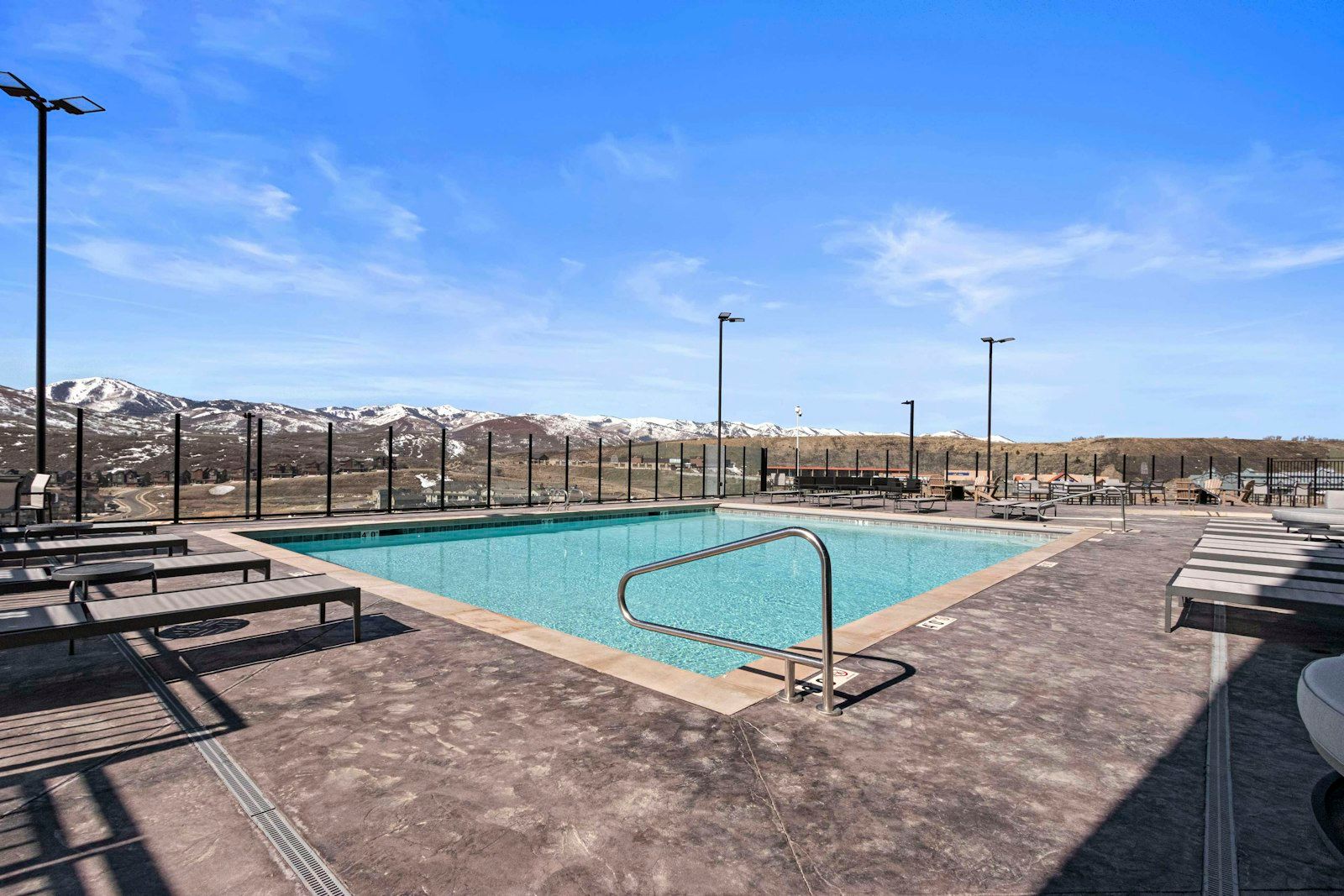 image Heated pool deck open year-round beneath the mountains