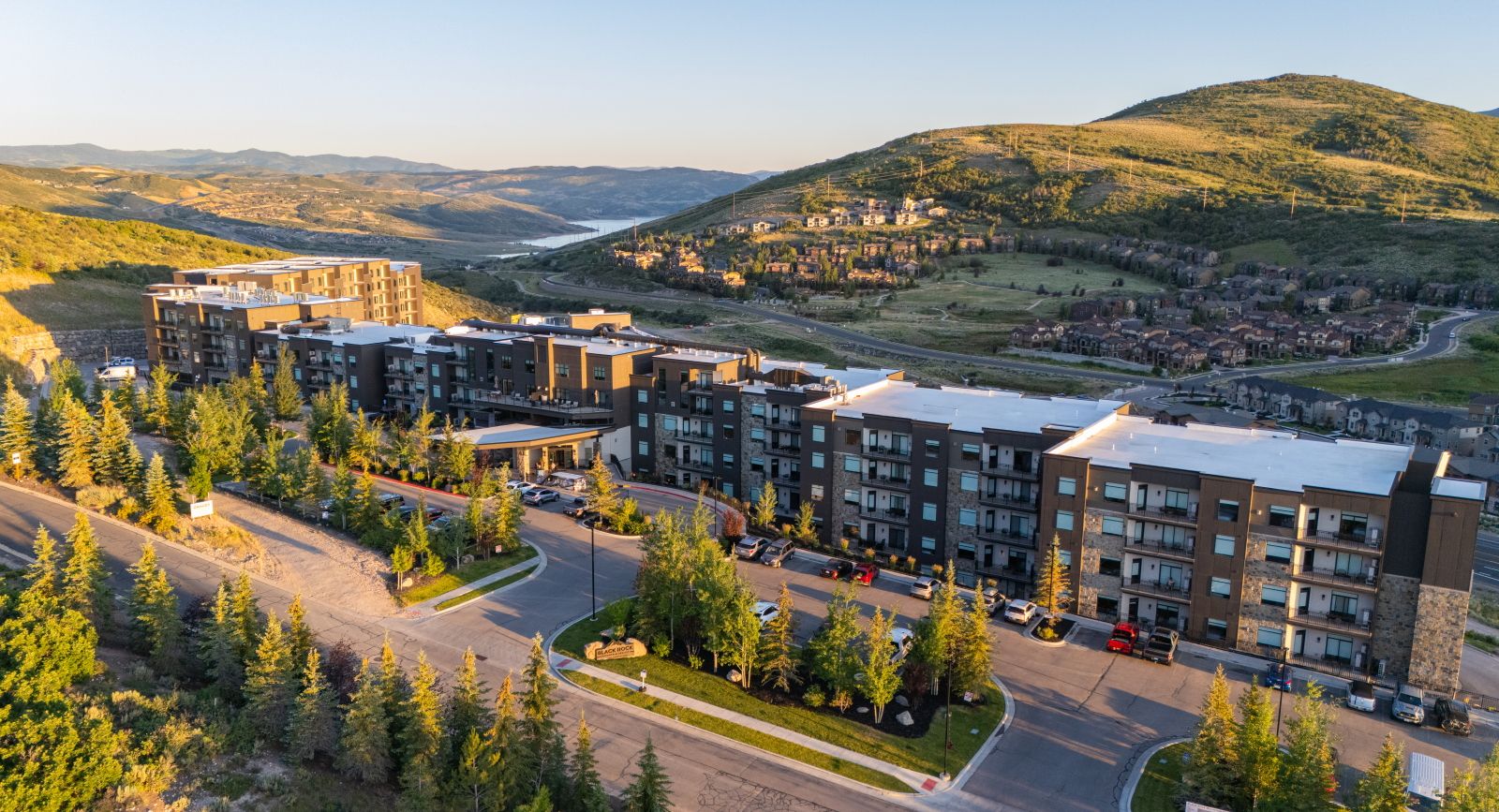 image Aerial view of resort building surrounded by trees and hills