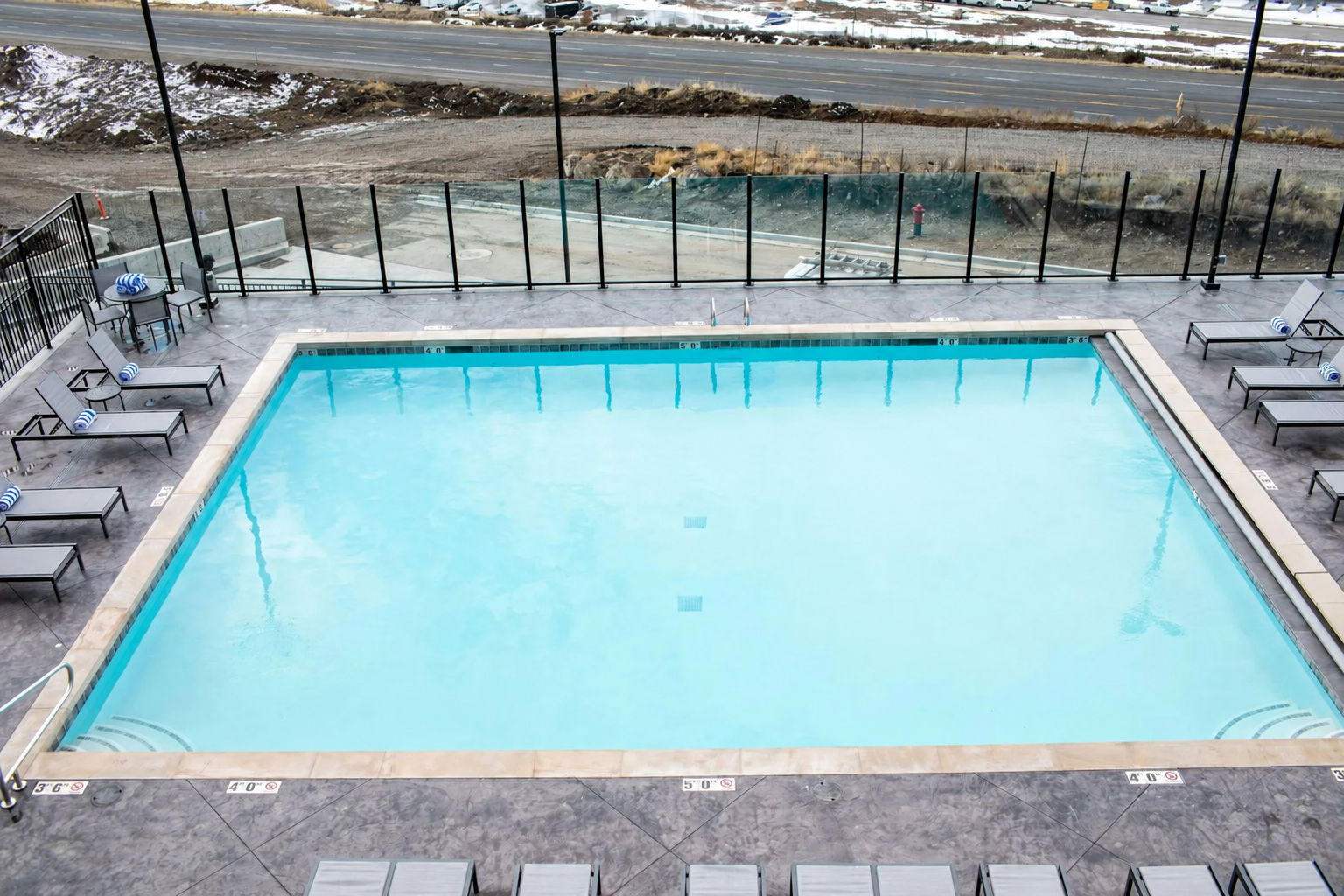 image Outdoor pool and hot tub with mountainside views