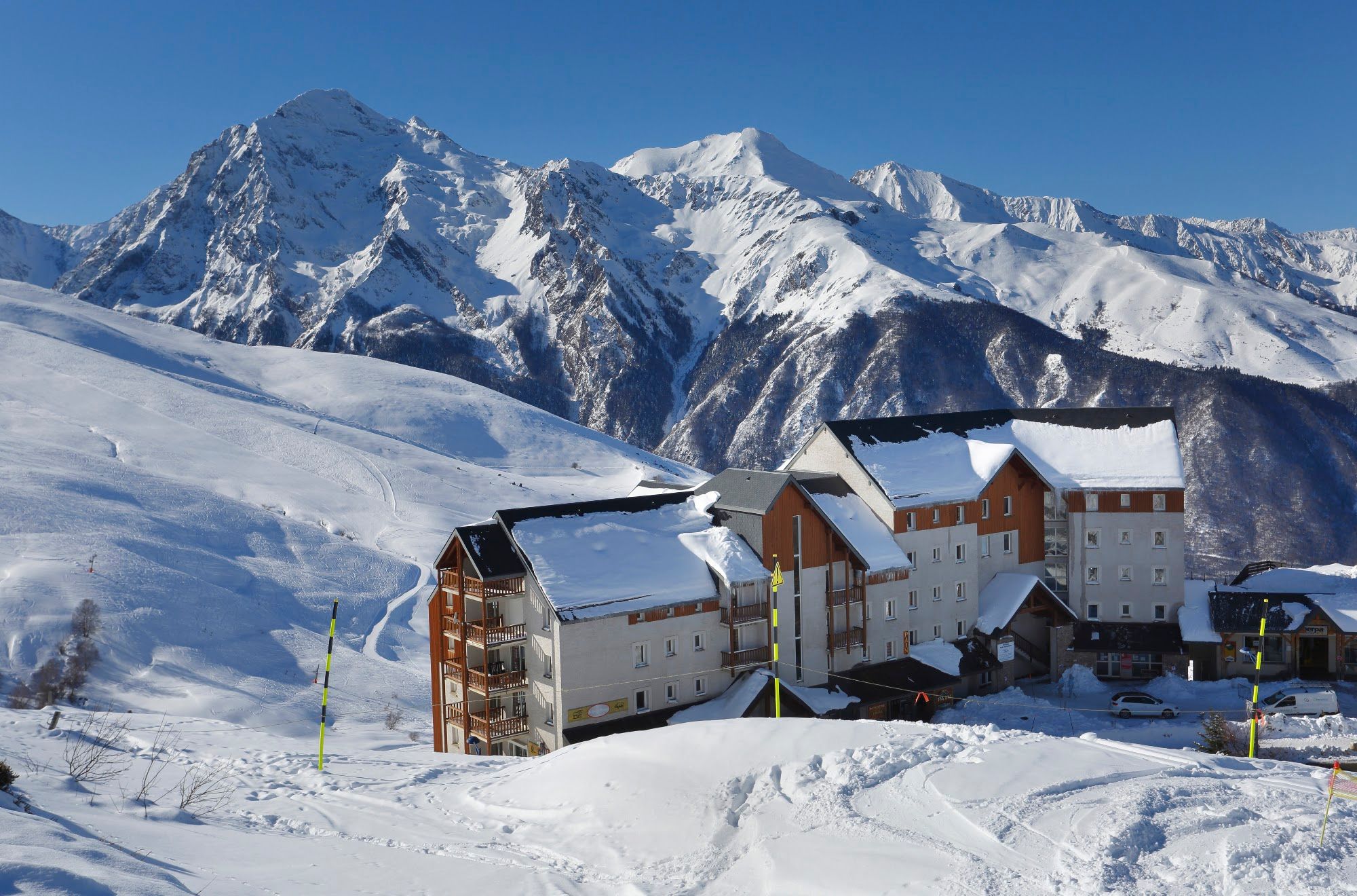 image The residence on the snowfield with the Pyrenean peaks beyond