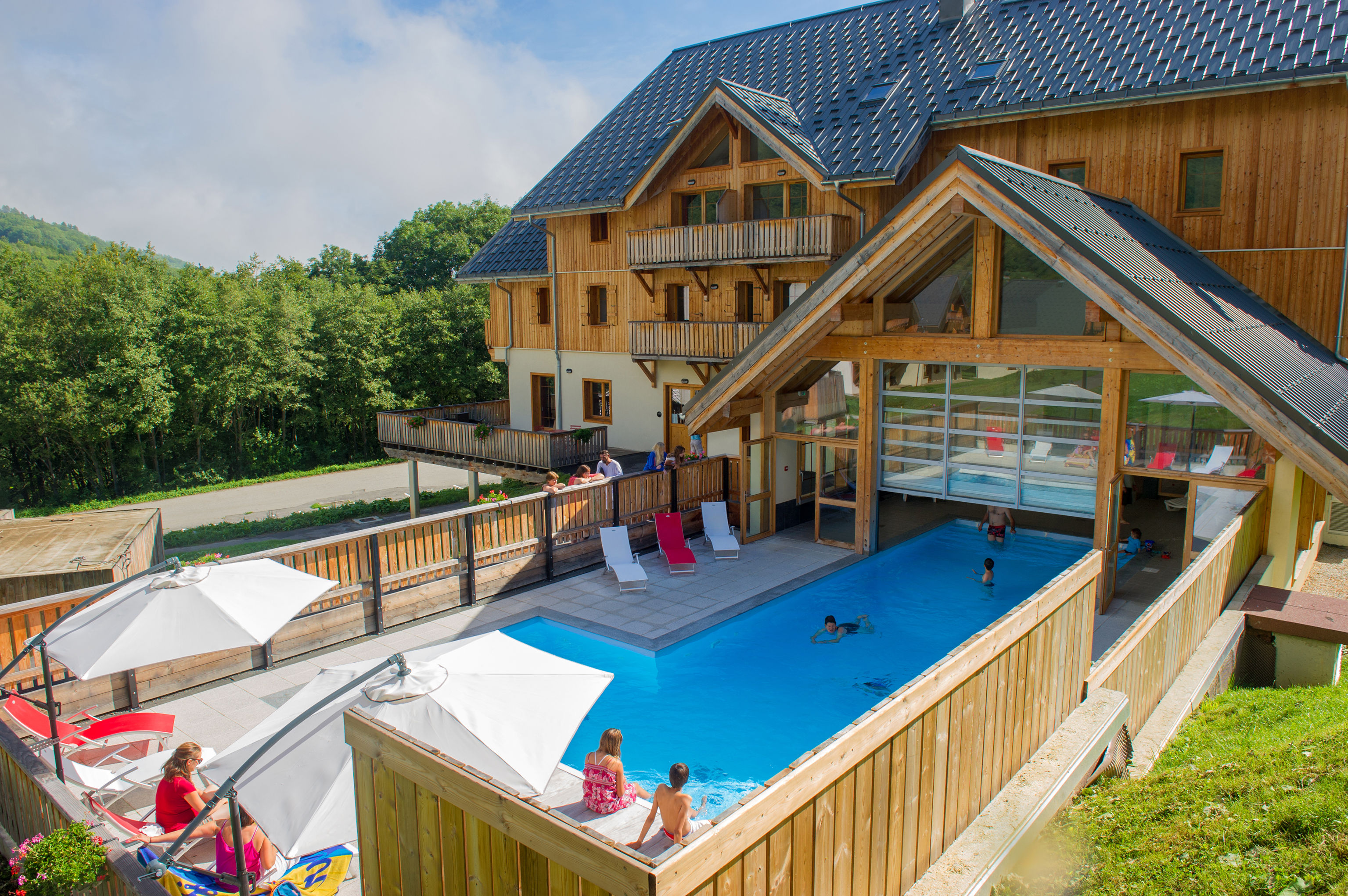 image Swimmers and sunbathers share the pool through the warmer months.