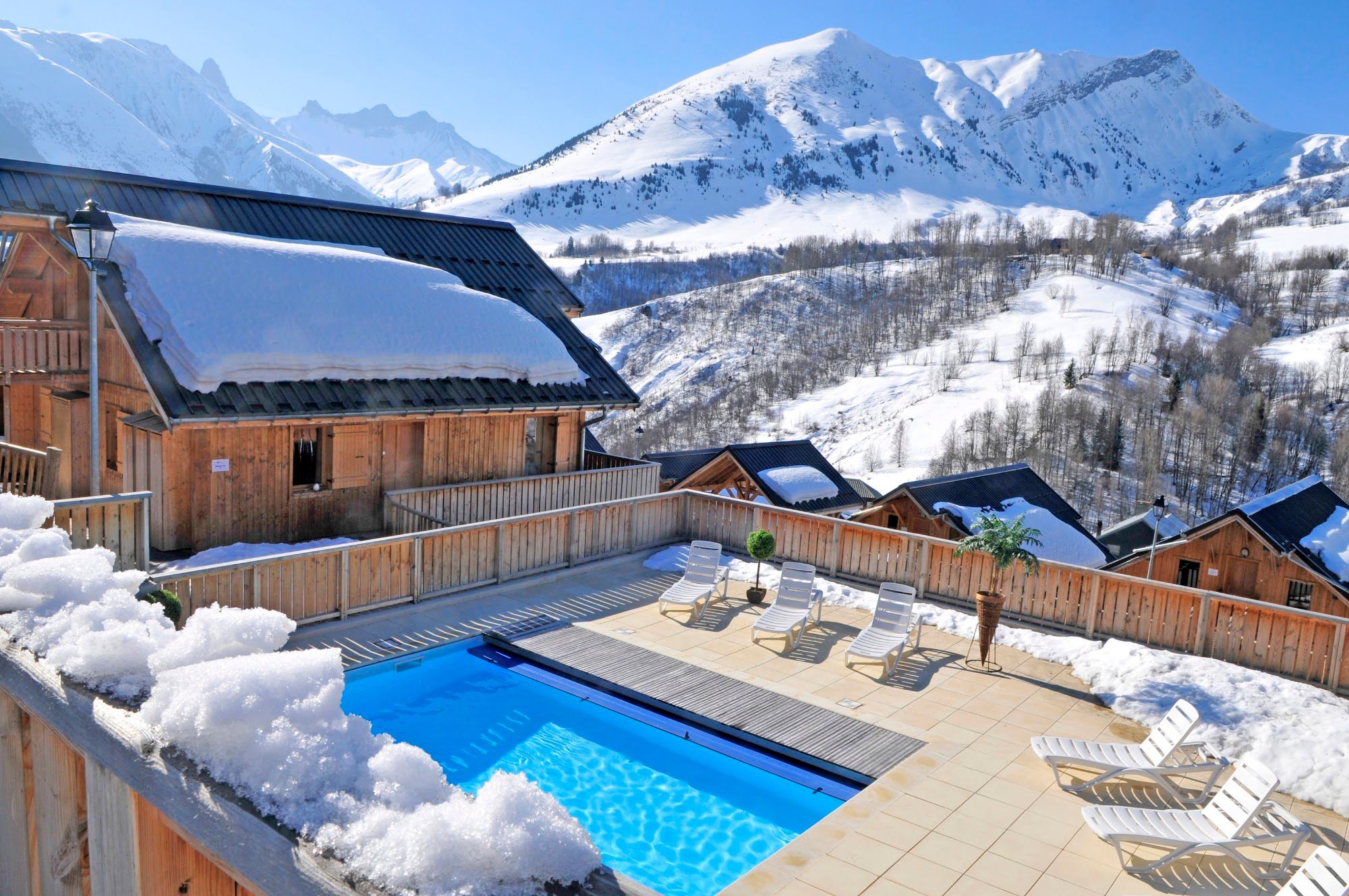 image Aerial view: residence, heated pool, pool terrace and mountains, winter (alt)