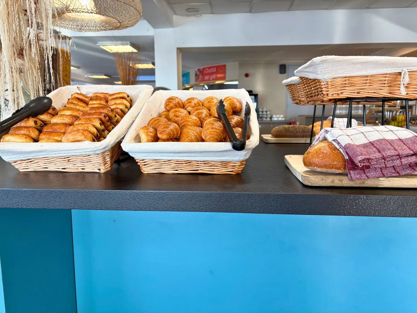 image Baskets of assorted pastries on display.