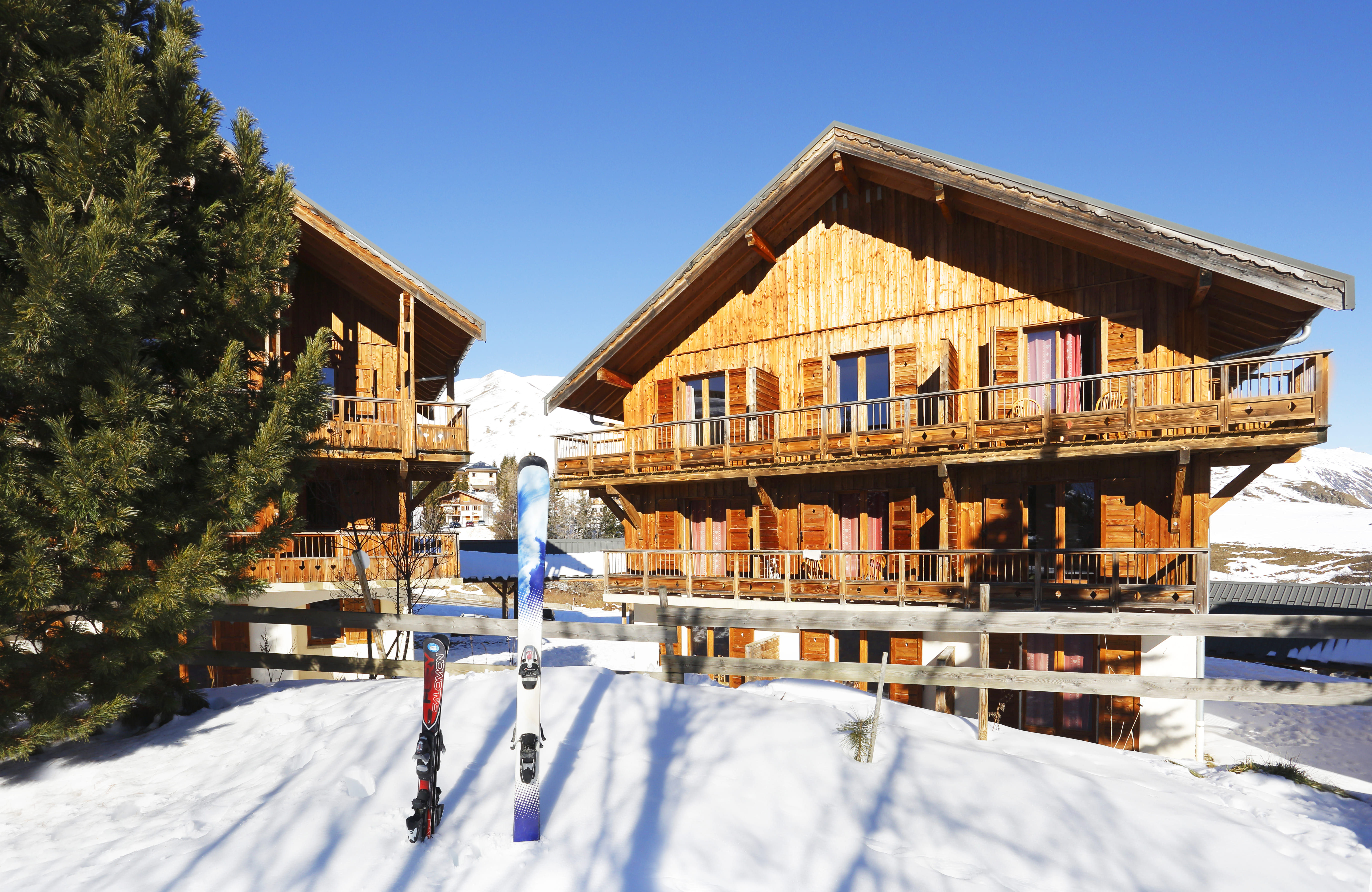 image Wooden chalets surrounded by snow.