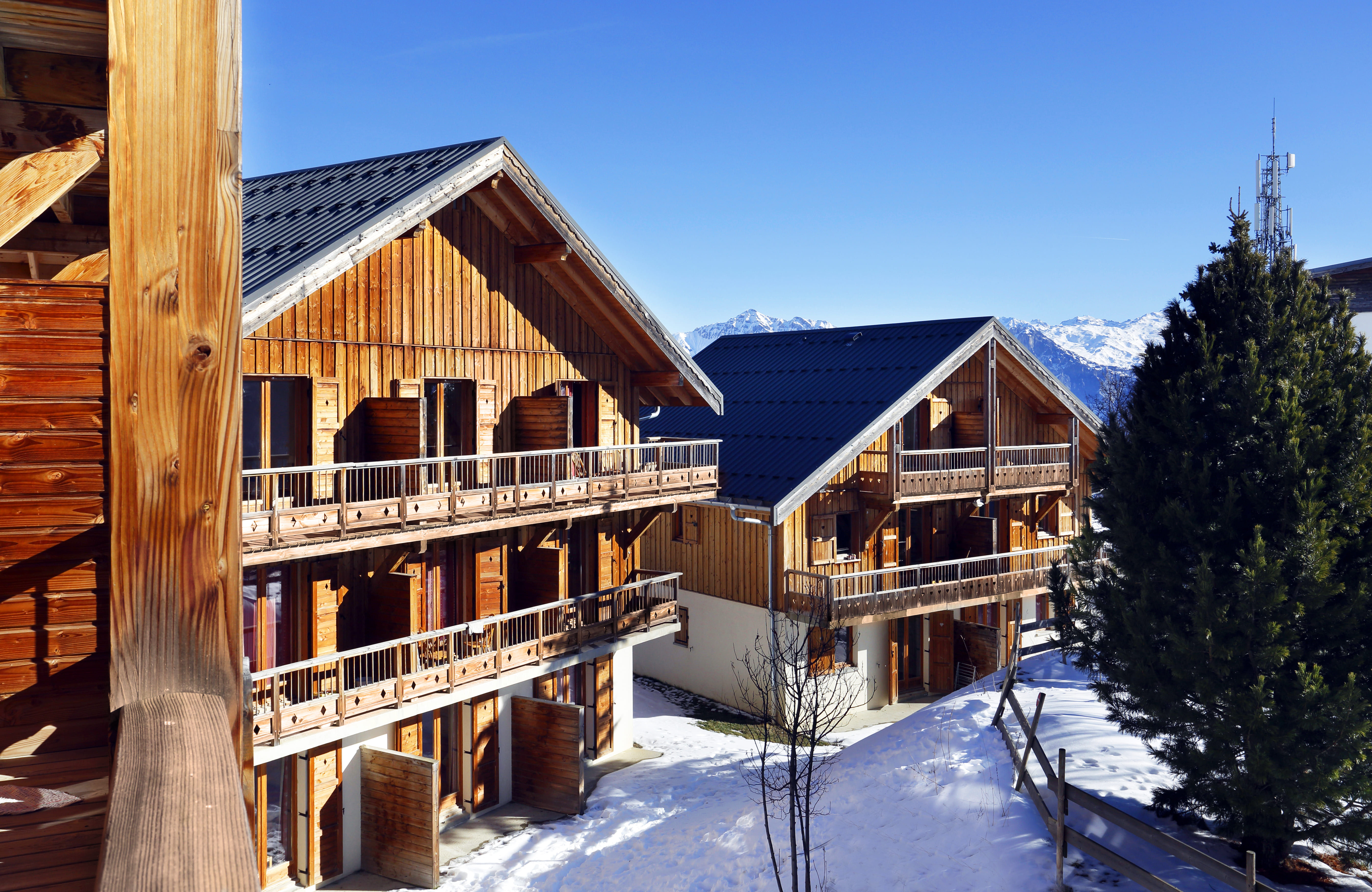 image Exterior view of wooden chalets.