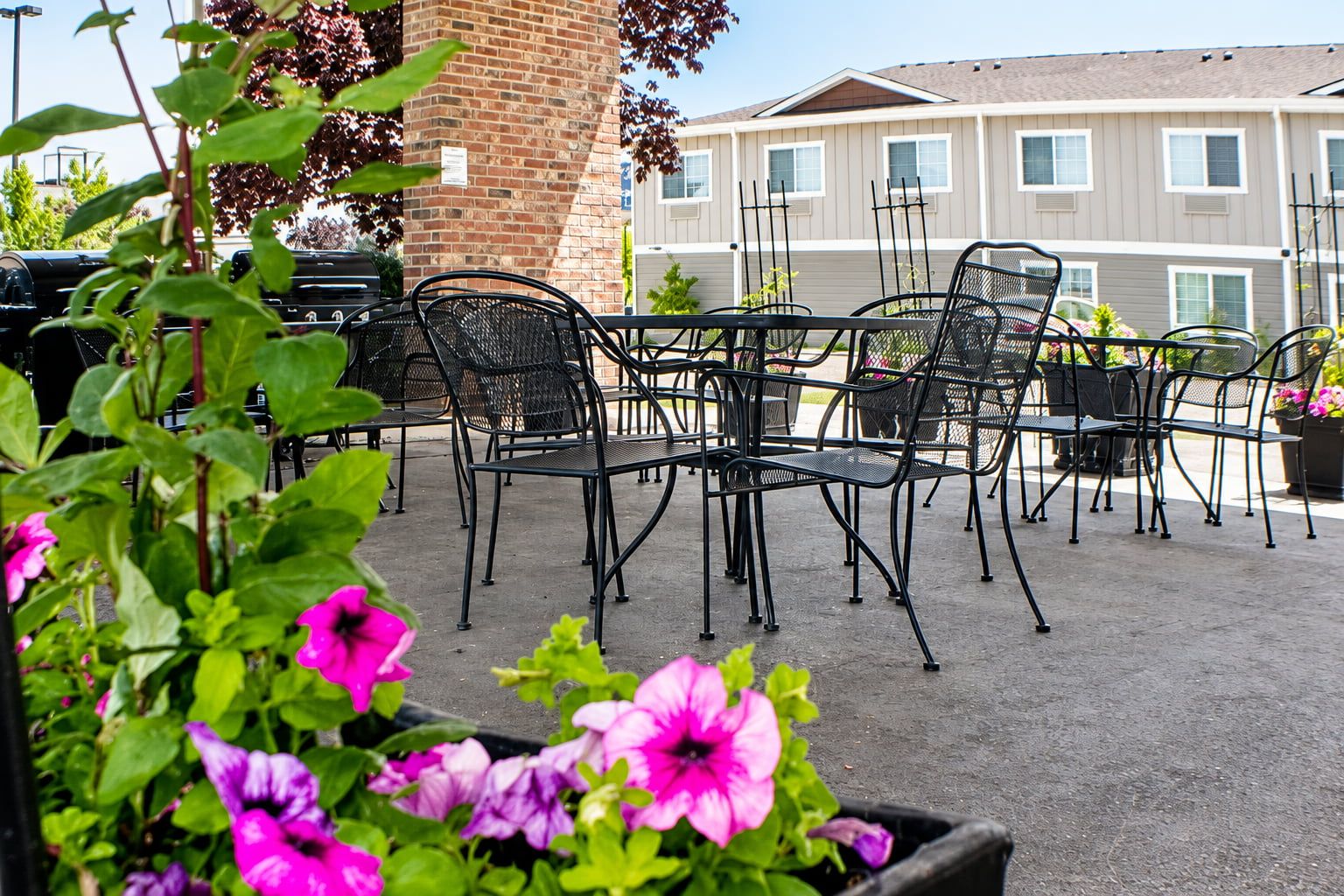 image Outdoor seating area with black chairs