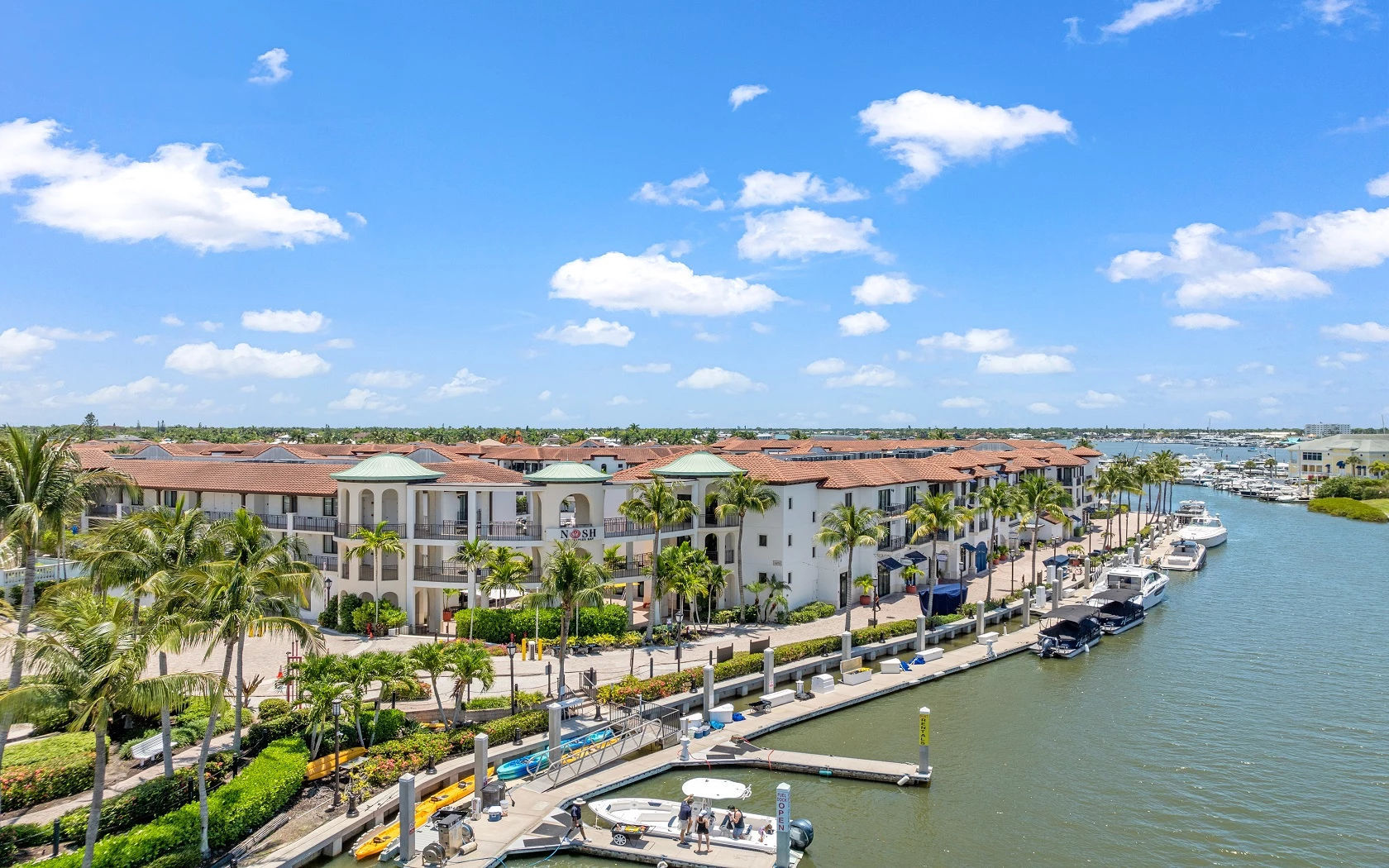 image Marina with moored boats and harbor buildings