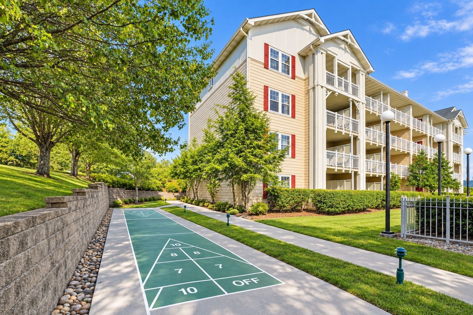 image Multi-story building with balconies and shuffleboard court