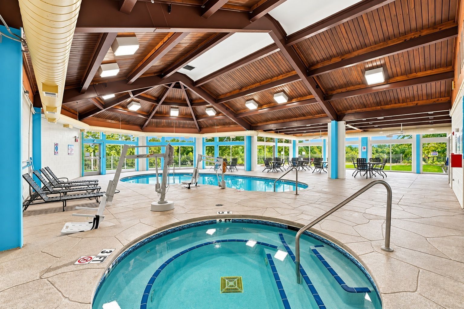 image Indoor pool area with surrounding seating